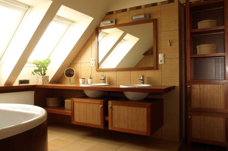 A bathroom designed with a rustic style interior, equipped with a mirror, double sink, and vanity with shelves below it.