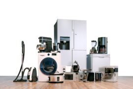 A variety of home appliances in one place, including a fridge, microwave, coffee maker, and washing machine.